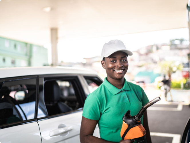 Fuel attendant operating a pump on the forecourt